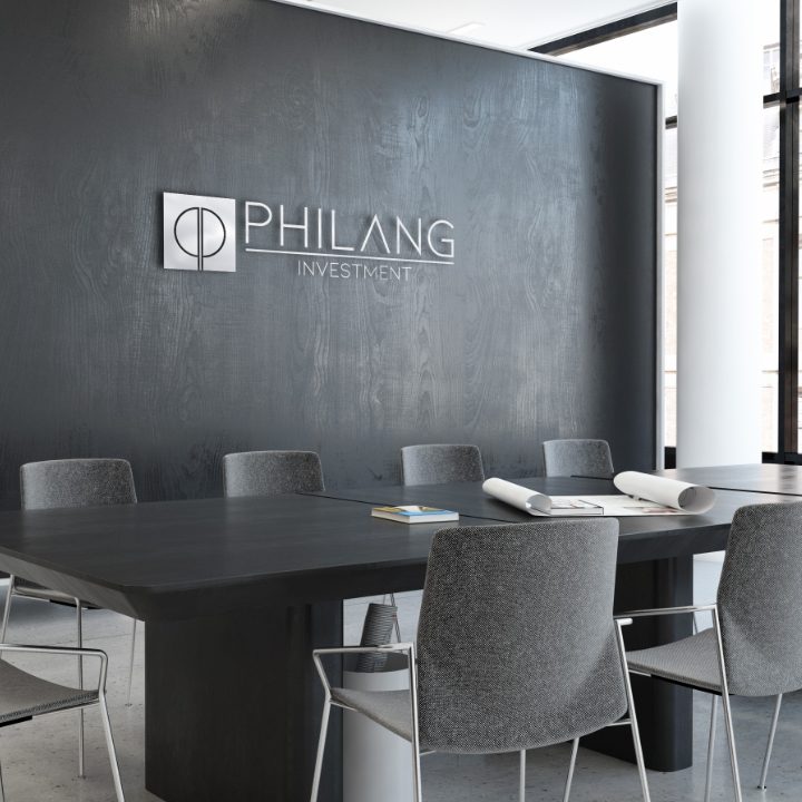 Philang Investment logo on metal signage on Boardroom black marble wall
