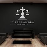 office logo cut-out signage placed on black wall at the waiting area